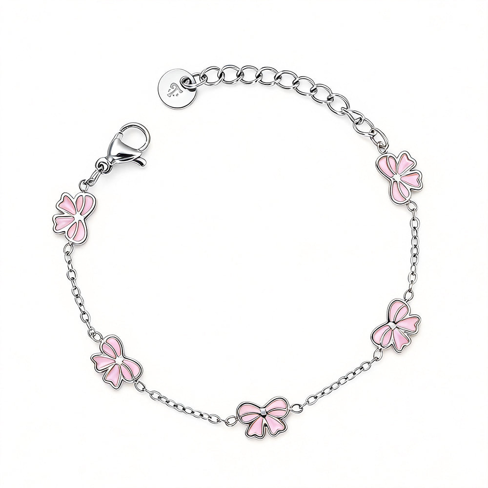 Kinderarmbandje - Roze strikjes