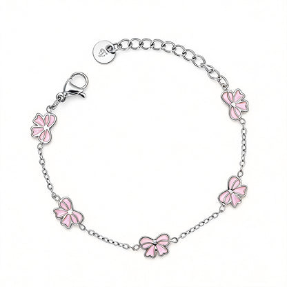 Kinderarmbandje - Roze strikjes